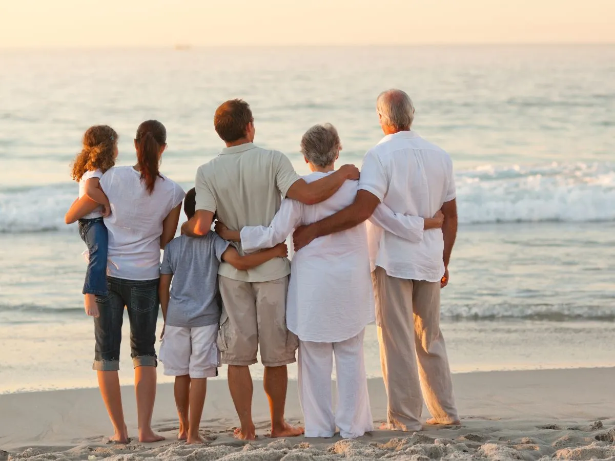 multigenerational family on shoreline